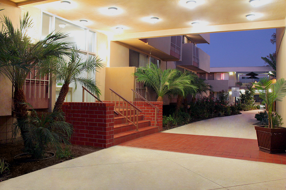 This banner image displays the apartment entrance photo for Anza Management Company client services page.